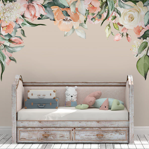 Ashley watercolor peony canopy wall decal framing a white daybed with pastel pillows