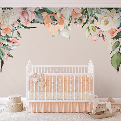Ashley pink and white rose garden canopy wall decal arching above a white nursery crib with a rocking horse