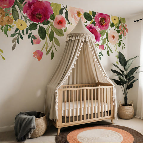Jessica’s Farmhouse pink floral border wall decal above a nursery crib with a canopy