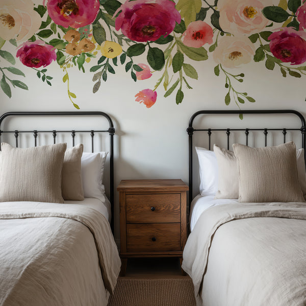 Dark pink floral border wall decal spanning the wall above two beds
