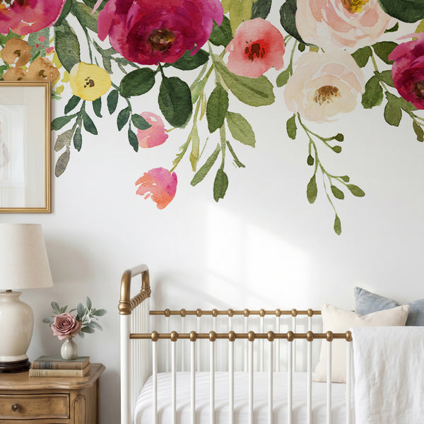Jessica’s Farmhouse pink and cream flowers above a metal nursery crib
