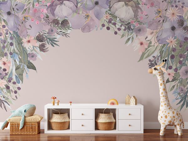 Watercolor wildflower canopy wall decal above white storage furniture in a nursery