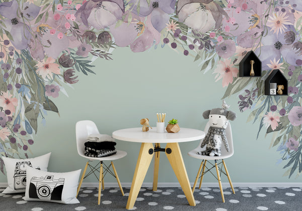 Pink and lavender wildflower canopy wall decal above a small table in a children’s playroom