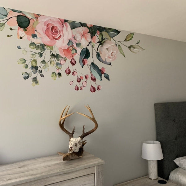 Trailing GAIA flowers and greenery above a bedroom dresser