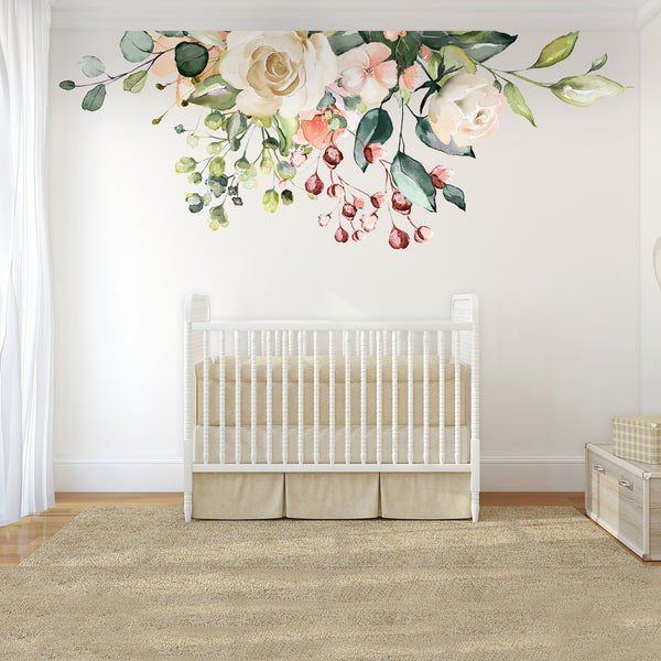 GAIA pink and ivory floral wall arrangement above a white crib