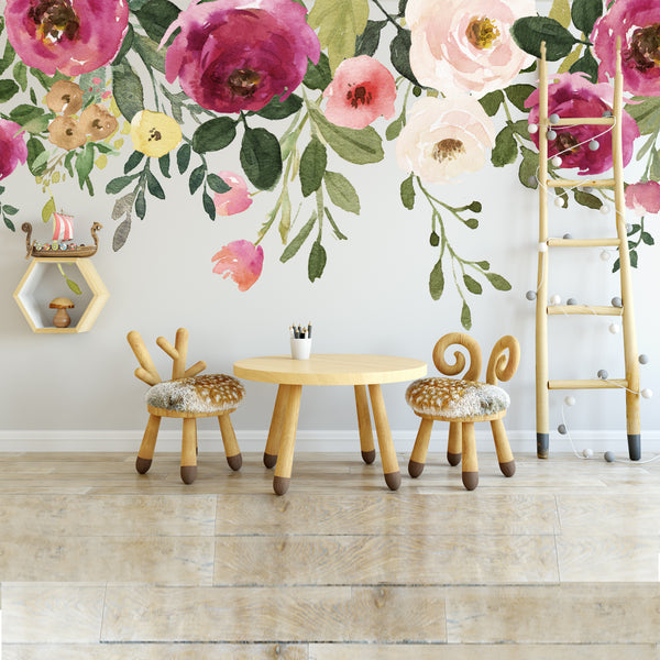 Pink and cream flower wall border above a children’s table and chairs