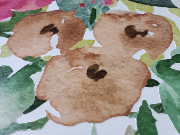 Close-up of warm tan watercolor blooms and green foliage