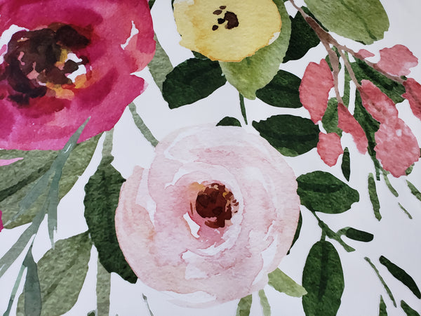 Detail of pink, cream and pale yellow flowers with green foliage