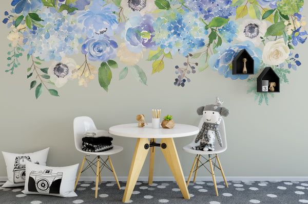 Blue floral border wall decal above a child’s desk and chairs