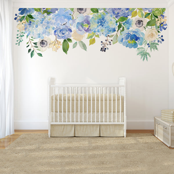 Serenity Creek blue and lavender flowers above a white nursery crib