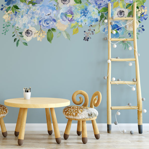 Blue and mint flower wall decal above a small play table