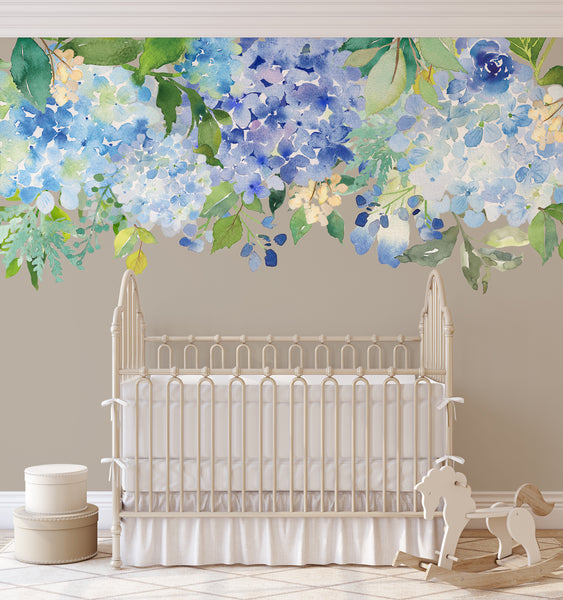 Blue and lavender Serenity Lake flowers cascading above a white crib