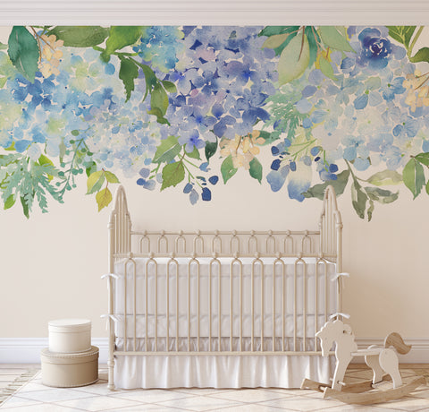 Serenity Lake blue watercolor floral border above a white nursery crib